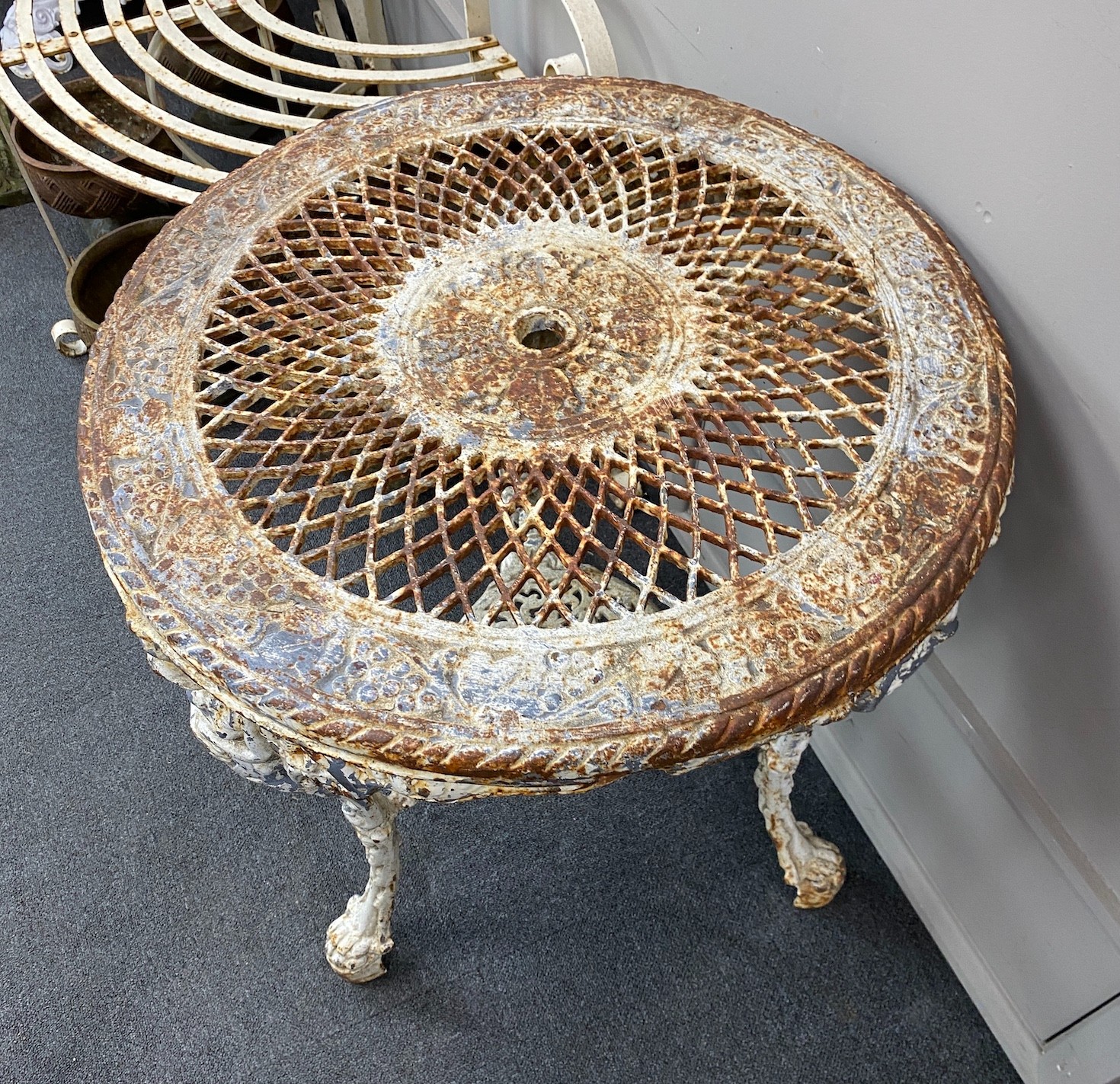 A Victorian painted cast iron circular Britannia table with pierced lattice work top, diameter 61cm, height 75cm